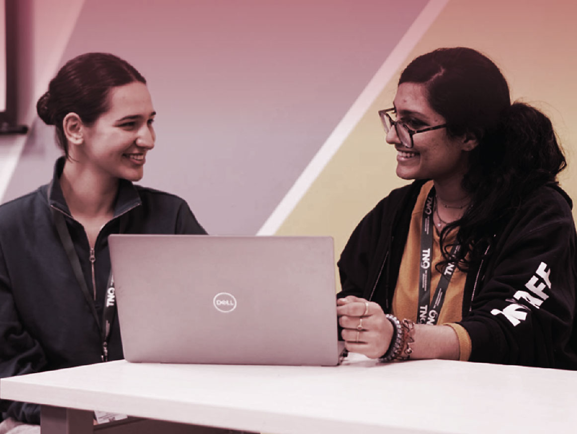 Two women working at The Neighbourhood Organization